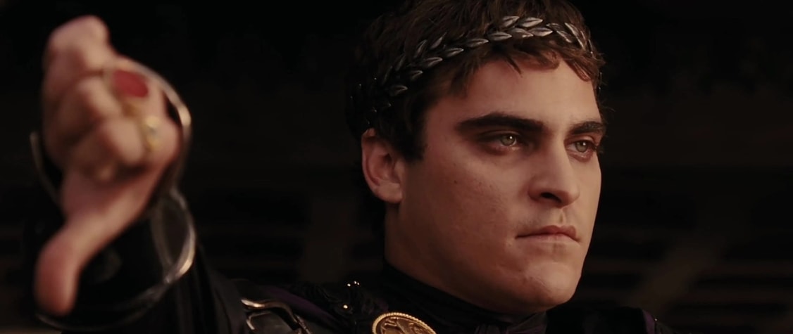 Joaquin Phoenix as Commodus in 'Gladiator,' tipping his thumb down in disapproval.