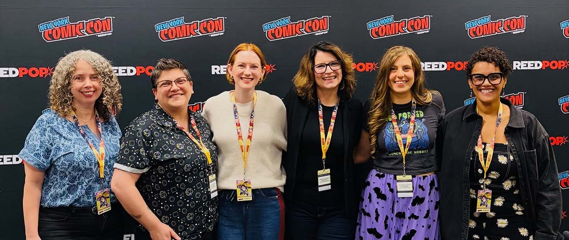 cozy fantasy authors standing together at comic con