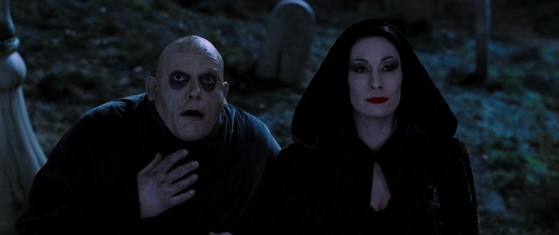 A still of Christopher Lloyd and Anjelica Houston in 'The Addams Family.'