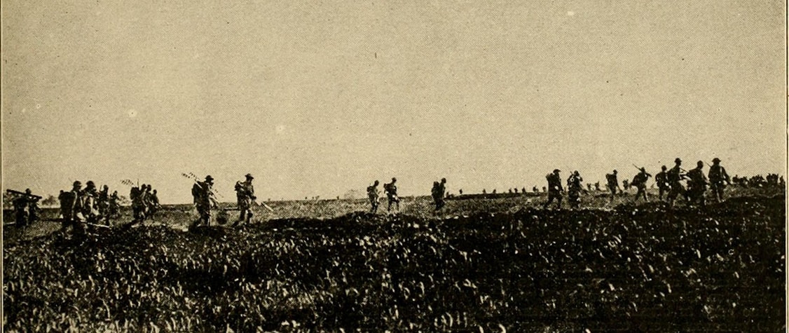 American soldiers walk along a ridge in Cantigny, the first American battle of World War I.