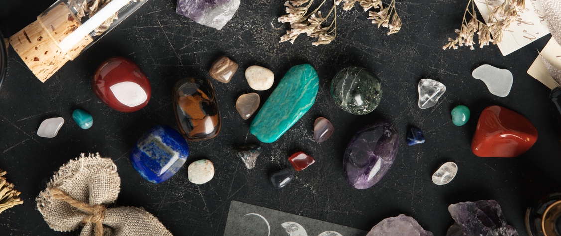 Image of stones, candles, flowers