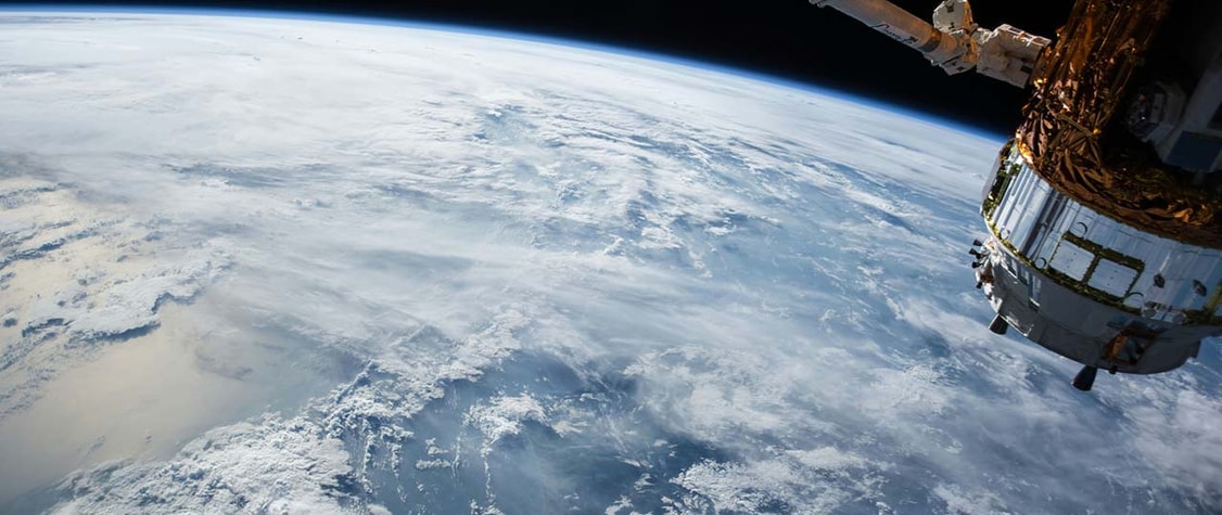 satellite orbiting earth, as seen from space