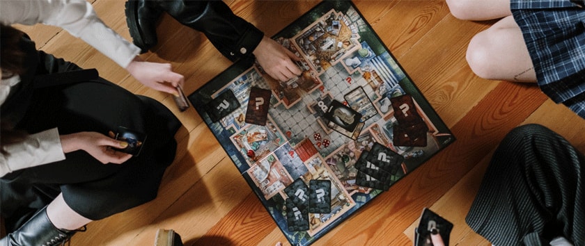 Photo of group of friends playing board game.