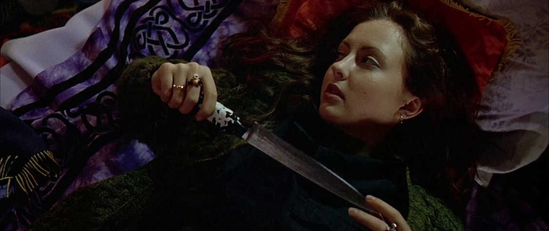 Film Still of Katharine Isabell "Ginger" holding a knife