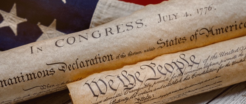Photo of the Declaration of Independence on an American flag.