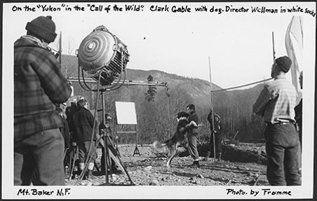 Clark Gable and a dog on set of "The Call of the Wild," 1935