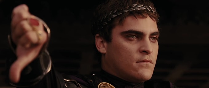 Joaquin Phoenix as Commodus in 'Gladiator,' tipping his thumb down in disapproval.