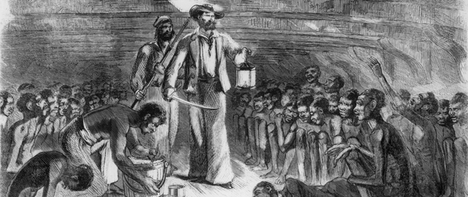 Scene of sailor walking among African captives in the hold of ship.