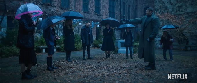 umbrella-academy umbrella academy screenshot shows superheroes at a funeral