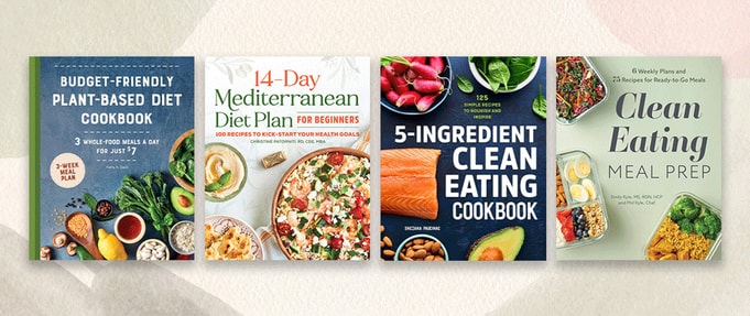 healthy-cookbooks_feature Four healthy cookbooks set against simple background.