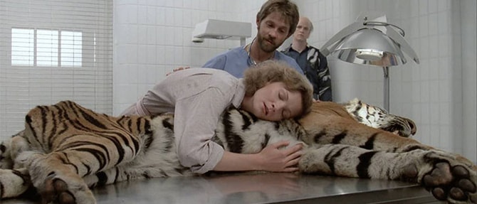 film-still_michael-manns-manhunter Film still from Manhunter. Woman hugging tiger on operating table