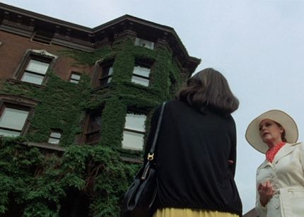 Two women standing in front of a home, in a still from the movie 'The Sentinel.'