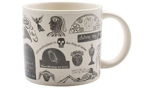 A mug with memento mori symbols on it