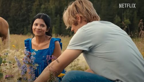 my-life-with-the-walter-boys-screenshot a girl looks at a boy in a field in the screenshot from 'My Life With the Walter Boys' trailer