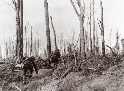Marines climb through desolated trees during the Battle of Belleau Woods.