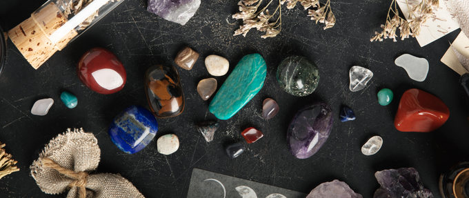 Image of stones, candles, flowers