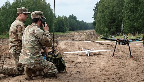 Image of soldiers operating a drone. 