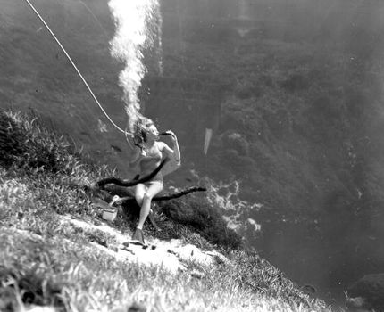 Woman drinking a coke underwater during performance as mermaid at Weeki Wachee Springs