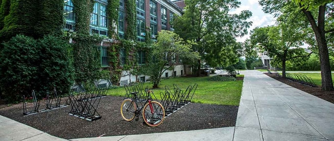 bikes on a rack outside a school