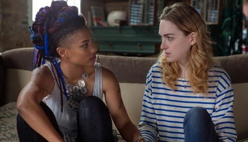 Amanita Caplan and Nomia Marks stare into each other's eyes in a still from 'Sense8'