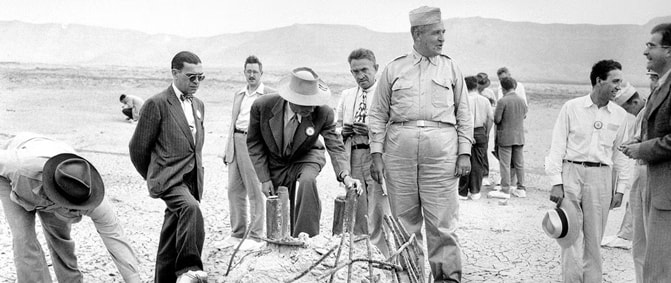books-about-the-manhattan-project_feature Maj. Gen. Groves and J. R. Oppenheimer view the base of the steel tower used for the first atomic bomb test.