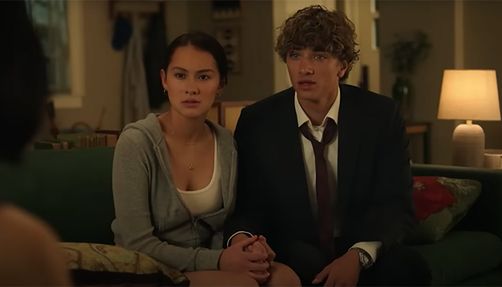 summer-i-turned-pretty-screenshot a girl holds a boy's hand in the screenshot from the trailer of 'the summer i turned pretty'