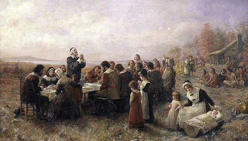 Illustration of settlers gathered around a feast. 