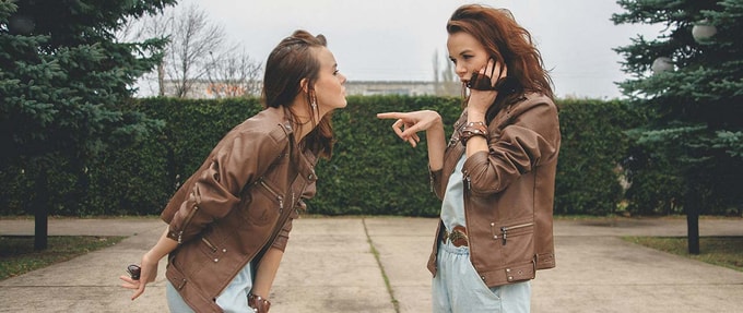 Two women look at one another