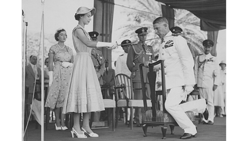 Elizabeth II knighting Claude Pelly in 1954.