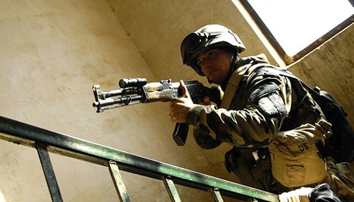 Image of U.S. soldier holding an AK-47.