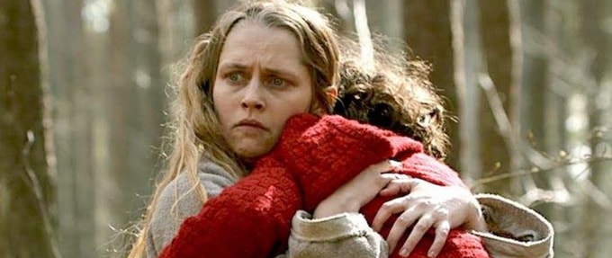 A mother clutching her child in a still from the movie 'The Twin'