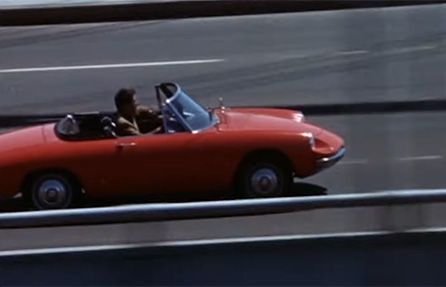 screenshot of dustin hoffman driving a convertible