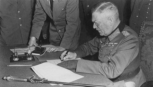 Field Marshal Wilhelm Keitel signing the unconditional surrender of the German Wehrmacht