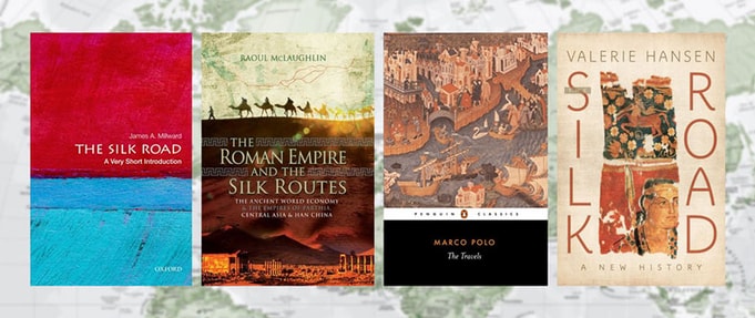 four book covers from article over green world map