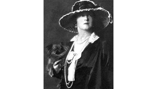 Photo of Lucy Duff-Gordon holding her dog