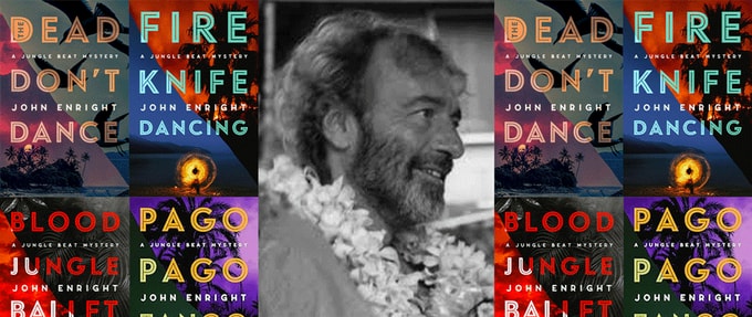 Photo of John Enright surrounded by books from his Jungle Beat Mystery series.