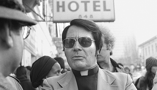 Reverend Jim Jones outside the International Hotel in San Francisco's Chinatown