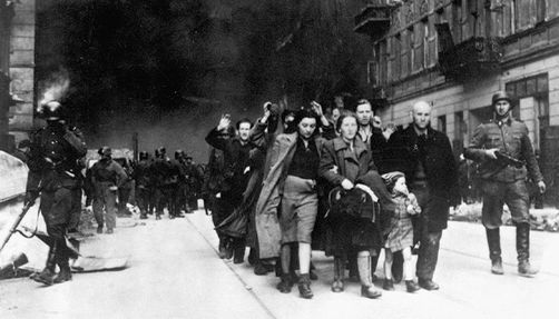 warsaw-ghetto-uprising_body Captured Jews are led by German Waffen SS soldiers to the assembly point for deportation
