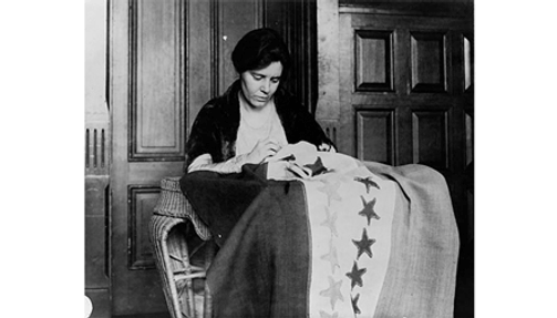 Alice Paul, sewing suffrage flag.