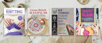 Various crafting books arranged on the backdrop of a table with crafting supplies.