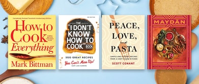 Four cookbooks set against blue background.