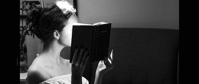 woman reading sexy romance book