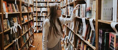 girl deciding whether to re-read a book